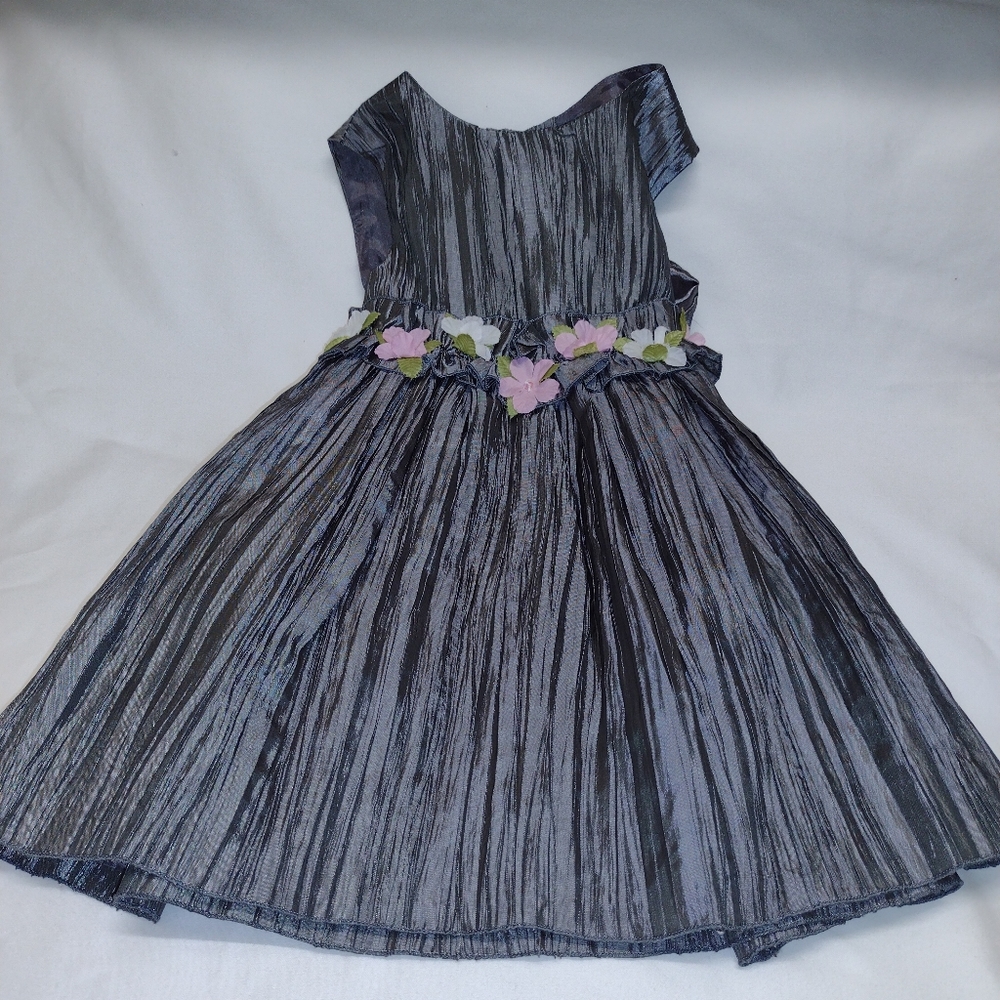 100% Polyester dress size 12 months.